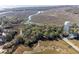 Beautiful aerial view shows waterfront community surrounded by marsh and rivers at 1409 Dune Loft Villas, Seabrook Island, SC 29455