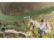 An aerial view of a marsh property with a private pier and lush greenery, a coastal retreat at 1409 Dune Loft Villas, Seabrook Island, SC 29455