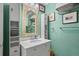 Charming bathroom with marble vanity, open shelving, and decorative mirror at 1409 Dune Loft Villas, Seabrook Island, SC 29455