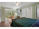Comfortable bedroom with ceiling fan, sitting area, and views of the outdoor scenery at 1409 Dune Loft Villas, Seabrook Island, SC 29455