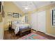 A charming bedroom with a pitched ceiling, a ceiling fan, and two closets at 1409 Dune Loft Villas, Seabrook Island, SC 29455