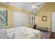 A charming bedroom with a pitched ceiling, a ceiling fan, and two closets at 1409 Dune Loft Villas, Seabrook Island, SC 29455
