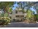 Inviting raised beach home featuring neutral siding and lush landscaping at 1409 Dune Loft Villas, Seabrook Island, SC 29455