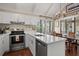 Updated kitchen with stainless appliances, white countertops and cabinets, open floor plan and natural light at 1409 Dune Loft Villas, Seabrook Island, SC 29455