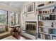 Bright living room with a fireplace and built in book cases at 1409 Dune Loft Villas, Seabrook Island, SC 29455