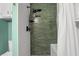 Modern shower with matte black fixtures, sleek tile, and rainfall shower head at 1409 Dune Loft Villas, Seabrook Island, SC 29455