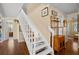 A staircase with white posts and a wooden handrail at 1409 Dune Loft Villas, Seabrook Island, SC 29455