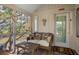 Cozy screened-in porch with comfortable seating and water views at 1409 Dune Loft Villas, Seabrook Island, SC 29455
