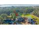 Aerial shot of a home with lush green trees surrounding a pond in the background at 1427 Shell Fish Ct, Mount Pleasant, SC 29466