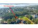An aerial view of a home surrounded by a pond and forest near the waterfront at 1427 Shell Fish Ct, Mount Pleasant, SC 29466