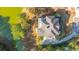 Aerial view showcases the home's roof with nearby pond, surrounded by trees and a circular driveway at 1427 Shell Fish Ct, Mount Pleasant, SC 29466