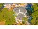 Aerial view of beautiful home surrounded by lush greenery, mature trees, and neighboring houses at 1427 Shell Fish Ct, Mount Pleasant, SC 29466