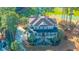 Aerial view of luxurious home and surrounding landscape featuring mature trees and a pond at 1427 Shell Fish Ct, Mount Pleasant, SC 29466