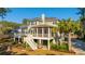 The back exterior features an elevated deck and screened porch with stairs leading to the yard at 1427 Shell Fish Ct, Mount Pleasant, SC 29466