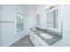 Bright bathroom with dual sinks, granite countertops, and white cabinets at 1427 Shell Fish Ct, Mount Pleasant, SC 29466