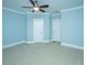 Spacious bedroom with a ceiling fan, neutral carpet, and two white doors at 1427 Shell Fish Ct, Mount Pleasant, SC 29466