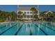 Exterior shot of community pool with palm trees and plenty of seating at 1427 Shell Fish Ct, Mount Pleasant, SC 29466