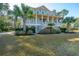 Charming two-story home with double porches and mature trees at 1427 Shell Fish Ct, Mount Pleasant, SC 29466