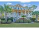 Charming two-story home with double porches, staircase and lush landscaping at 1427 Shell Fish Ct, Mount Pleasant, SC 29466