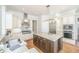 Gourmet kitchen with stainless steel appliances, granite countertops, custom cabinetry, and a large kitchen island at 1427 Shell Fish Ct, Mount Pleasant, SC 29466
