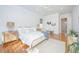 Comfortable main bedroom with hardwood floors, neutral decor, large windows, and elegant furnishings at 1427 Shell Fish Ct, Mount Pleasant, SC 29466
