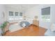 Sun-filled main bedroom with hardwood floors, large windows, and neutral decor, creating a relaxing retreat at 1427 Shell Fish Ct, Mount Pleasant, SC 29466