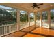 Screened porch featuring wood floors and view of pond and trees at 1427 Shell Fish Ct, Mount Pleasant, SC 29466