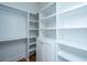 Spacious walk-in closet with custom built-in shelves and drawers, offering ample storage and organization at 1427 Shell Fish Ct, Mount Pleasant, SC 29466