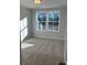 Bedroom featuring a large window with natural light and neutral carpet at 143 Cantona Dr, Summerville, SC 29483