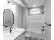 This bathroom features black hardware, a single sink vanity, and a shower-tub combination at 143 Harvest Way, Walterboro, SC 29488
