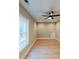 Bright bedroom with hardwood floors, neutral walls, ceiling fan and a large window at 143 Harvest Way, Walterboro, SC 29488
