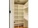 A walk-in closet features several shelves and a clothes-hanging rack at 143 Harvest Way, Walterboro, SC 29488