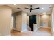 Bright hallway with hardwood floors, neutral walls, a modern ceiling fan and a custom storage feature at 143 Harvest Way, Walterboro, SC 29488