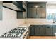 Modern kitchen featuring gray cabinets, white countertops, and stainless steel appliances at 143 Harvest Way, Walterboro, SC 29488