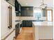 This kitchen showcases modern design with gray cabinets, white marble counters, and stainless appliances at 143 Harvest Way, Walterboro, SC 29488