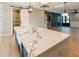 This kitchen boasts a large island, open layout, and modern lighting, perfect for entertaining guests at 143 Harvest Way, Walterboro, SC 29488