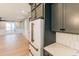 Open concept kitchen flowing into the living area with stainless steel appliances at 143 Harvest Way, Walterboro, SC 29488