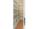 Spacious pantry with custom built-in shelving provides ample storage and organization in this home at 143 Harvest Way, Walterboro, SC 29488