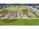 A beautifully designed community park featuring manicured lawns, shade structures and a pond at 1437 Clay Field Trl, Summerville, SC 29485