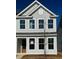 Charming two-story home with gray siding, white trim, and a welcoming front door at 147 Cantona Dr, Summerville, SC 29483