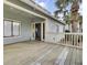 Relaxing back porch area featuring a wooden floor and access to green backyard views at 1481 Center Street Ext # 601, Mount Pleasant, SC 29464
