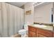 Bathroom with a vanity, decorative mirror and a shower with a white curtain at 1481 Center Street Ext # 601, Mount Pleasant, SC 29464