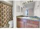 Bathroom with a vanity, decorative mirror and a shower with a patterned curtain at 1481 Center Street Ext # 601, Mount Pleasant, SC 29464