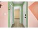 Hallway featuring light wood flooring, neutral walls and white doors at 1481 Center Street Ext # 601, Mount Pleasant, SC 29464