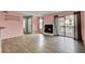Open living room with fireplace and sliding doors leading to a balcony at 1481 Center Street Ext # 601, Mount Pleasant, SC 29464