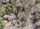 An aerial view shows a home nestled among trees, with a driveway and street visible at 1521 Lynton Ave, Charleston, SC 29412