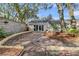 View of the back patio with pavers, large sliding glass doors, and fenced in backyard at 1521 Lynton Ave, Charleston, SC 29412