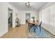 Open-concept dining area with a dining table, wood floors, and stylish decor at 1521 Lynton Ave, Charleston, SC 29412