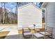 Outdoor patio features stylish seating and view of lush trees and driveway at 153 Cantona Dr, Summerville, SC 29483
