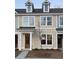 Charming townhome featuring a symmetrical facade, dormer windows, and a welcoming front porch at 155 Cantona Dr, Summerville, SC 29483